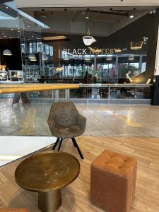 Inside Black Notes Coffee Roasters in Belval, looking towards the counter