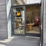 The Dalmat CoffeeHouse corner frontage in Belval, with seating visible inside