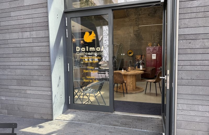 The Dalmat CoffeeHouse corner frontage in Belval, with seating visible inside
