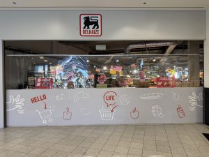 The Delhaize Belval entrance behind renovation hoarding in Belval Plaza