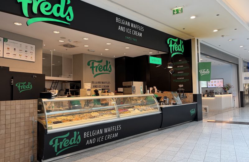 The Fred's counter in Belval Plaza, under its green sign