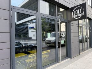 The Jolt Coffee frontage in Belval, with its round sign above the window