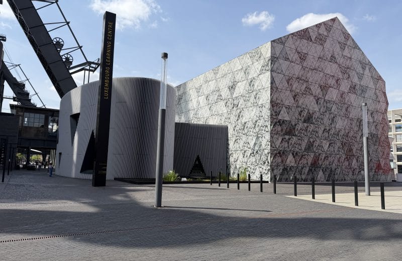 The Luxembourg Learning Centre in Belval, its patterned facade beside the industrial structures