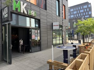 The MK Bar entrance in Belval, with planters along the front