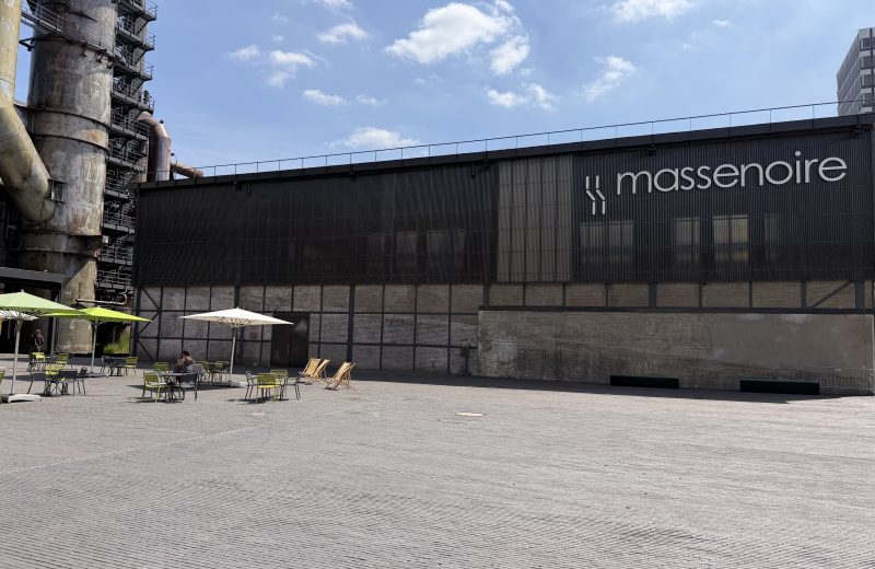 The Massenoire hall in Belval, with its sign along the front and the furnace structure beside it