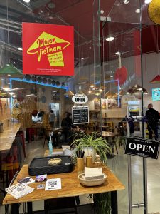 Inside Moien Vietnam in Belval Plaza, seen through the glass front