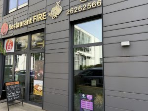 The Restaurant Fire frontage in Belval, with its sign and phone number