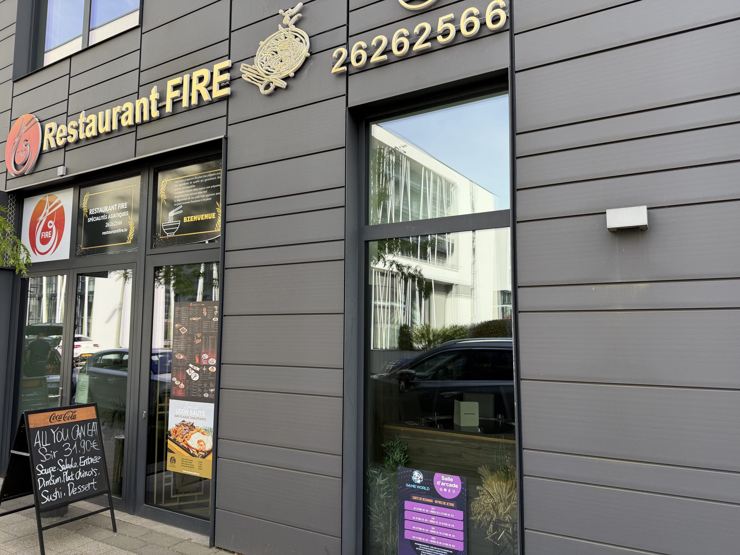 The Restaurant Fire frontage in Belval, with its sign and phone number