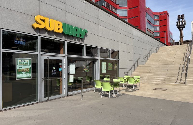 The Subway shopfront in Belval, under its yellow sign beside the steps