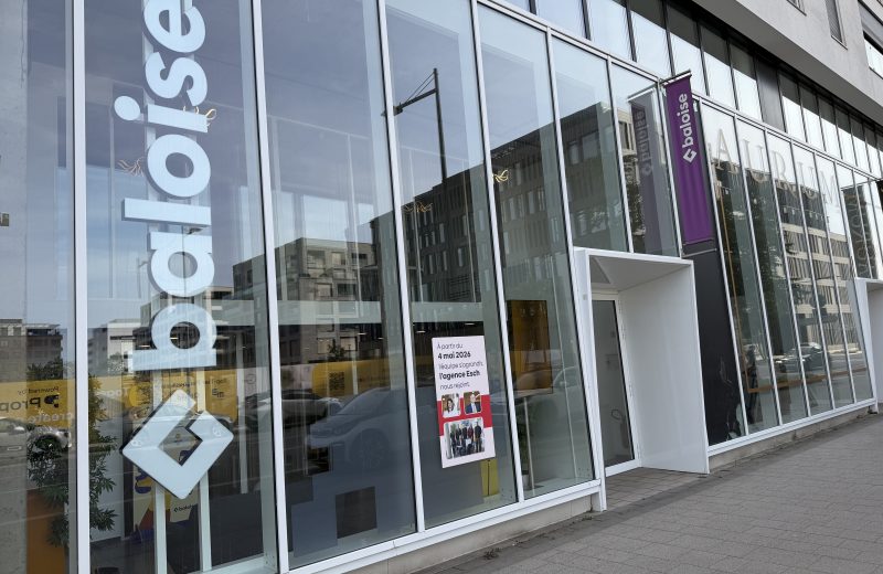The Baloise insurance agency on boulevard du Jazz in Belval, with the Baloise name on the glass and a notice announcing that the Esch agency joined in May 2026.