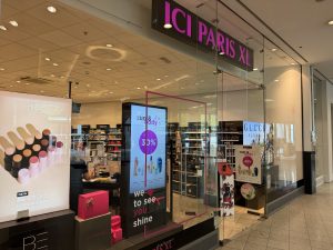 The ICI PARIS XL shopfront in Belval Plaza, with the pink ICI PARIS XL sign above the entrance and perfume bottles and BB stick displays visible through the glass.
