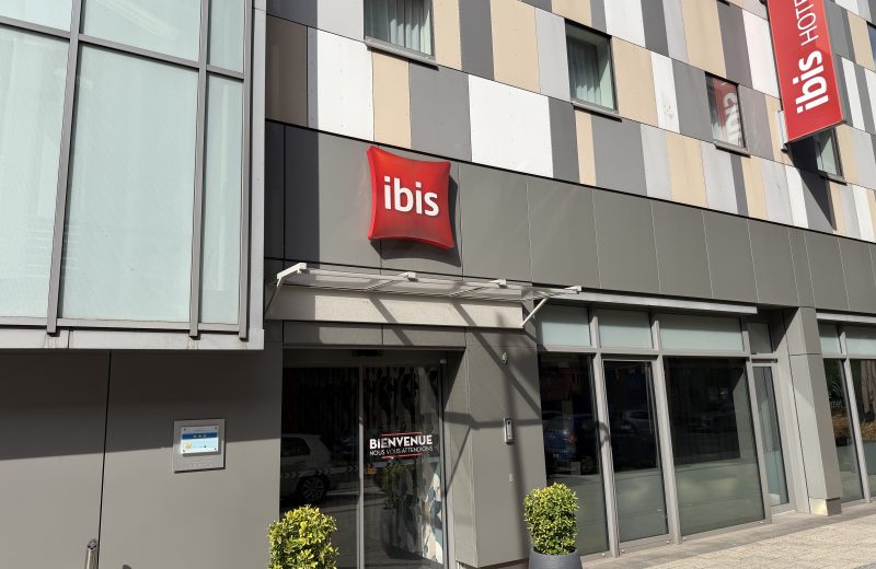 Exterior entrance and red ibis signs at ibis Esch Belval on Avenue du Rock’n’Roll.