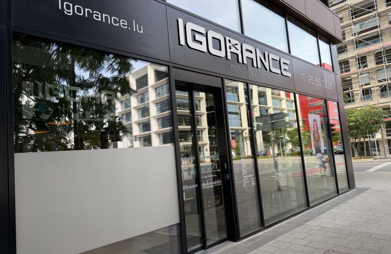 The Igorance hair salon on Porte de France in Belval, with its black fascia, the tagline mon coiffeur créateur and a price list displayed in the window.