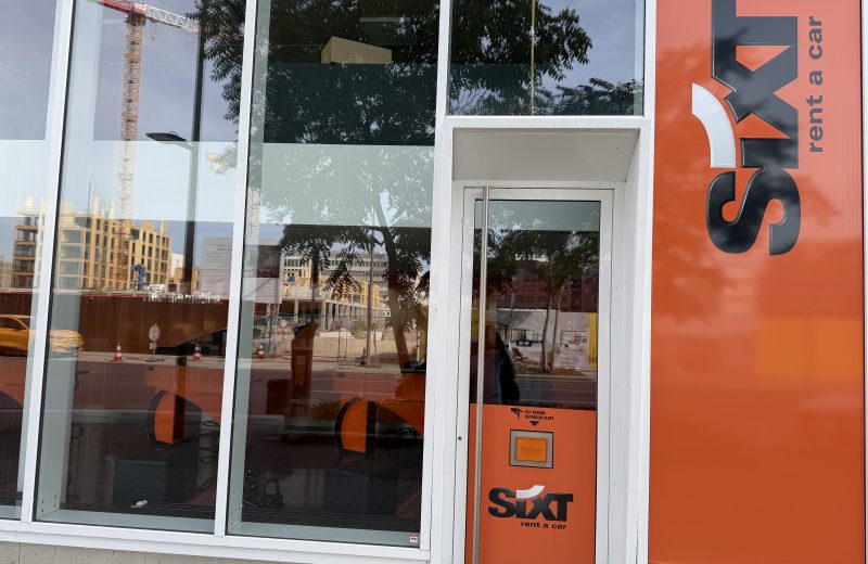 The Sixt car hire branch on boulevard du Jazz in Belval, with the orange Sixt frontage and a key return box beside the door.