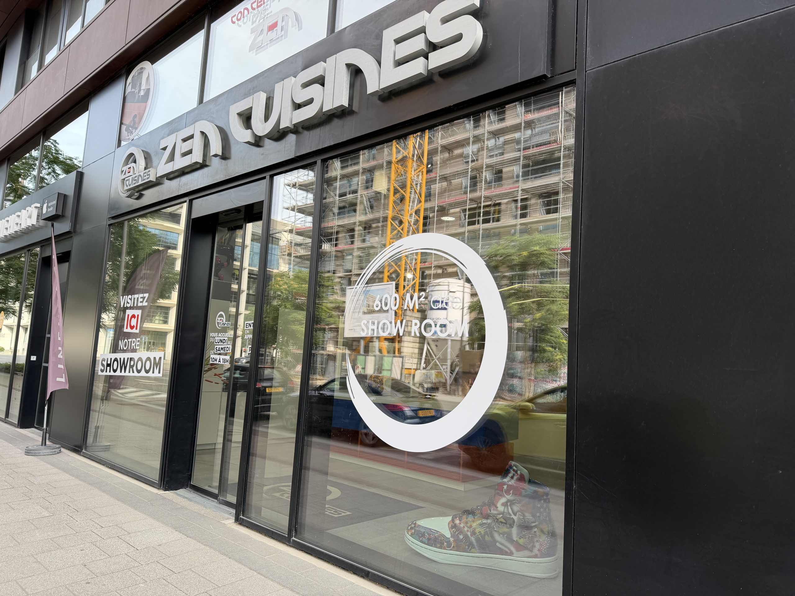 The Zen Cuisines showroom on boulevard du Jazz in Belval, with the shop name above the window and a 600 m² showroom decal on the glass.