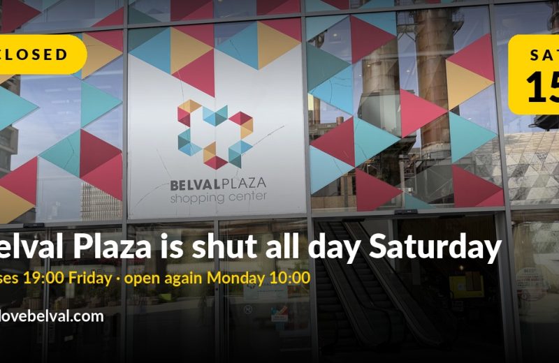 The glass front of Belval Plaza shopping centre with the blast furnace reflected in the windows, overlaid with the words "Belval Plaza is shut all day Saturday. Closes 19:00 Friday, open again Monday 10:00."