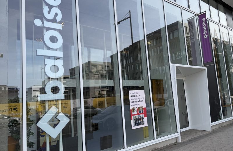 The Baloise insurance agency on boulevard du Jazz in Belval, with the Baloise name on the glass and a notice announcing that the Esch agency joined in May 2026.