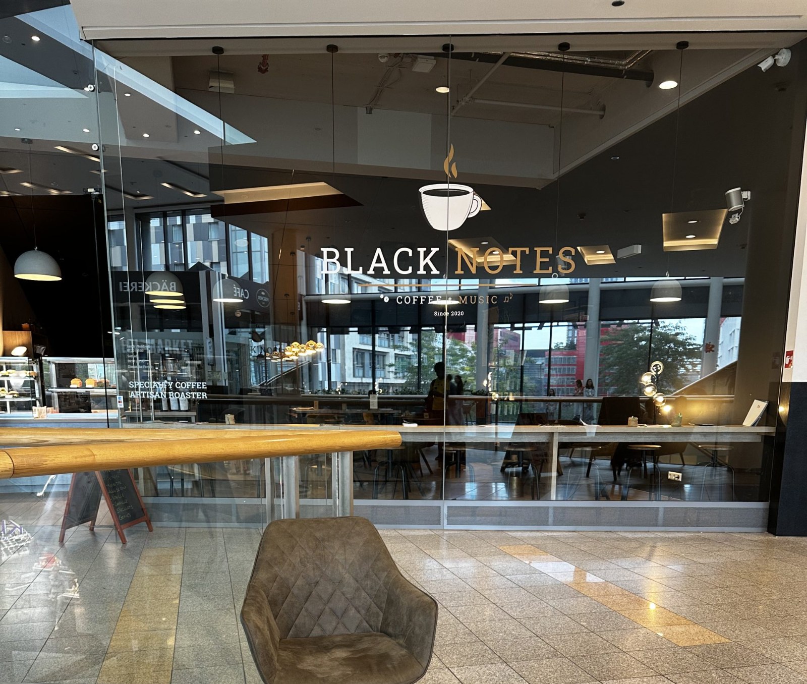 Inside Black Notes Coffee Roasters in Belval, looking towards the counter