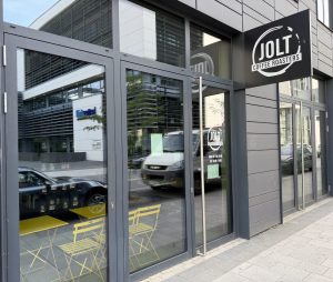 The Jolt Coffee frontage in Belval, with its round sign above the window