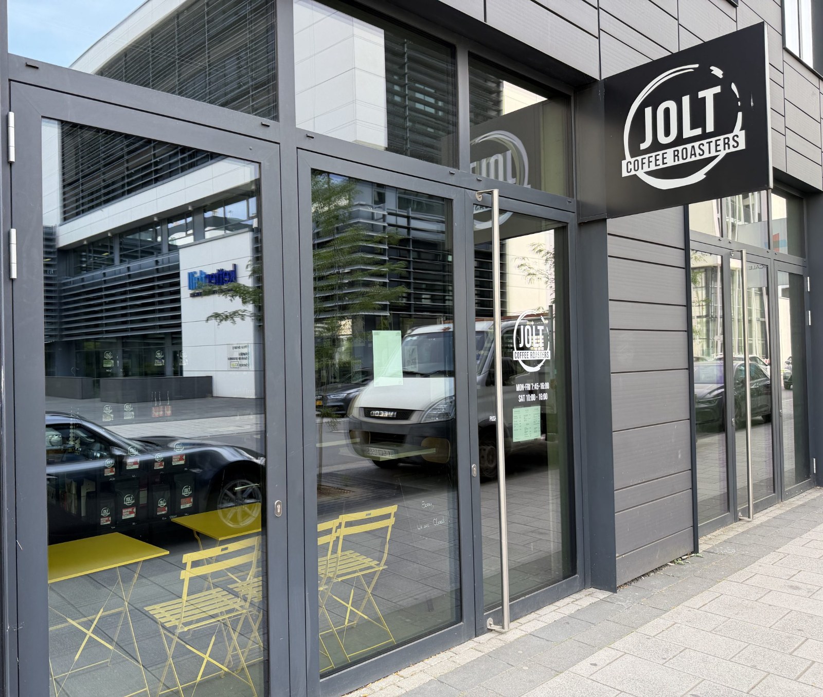 The Jolt Coffee frontage in Belval, with its round sign above the window