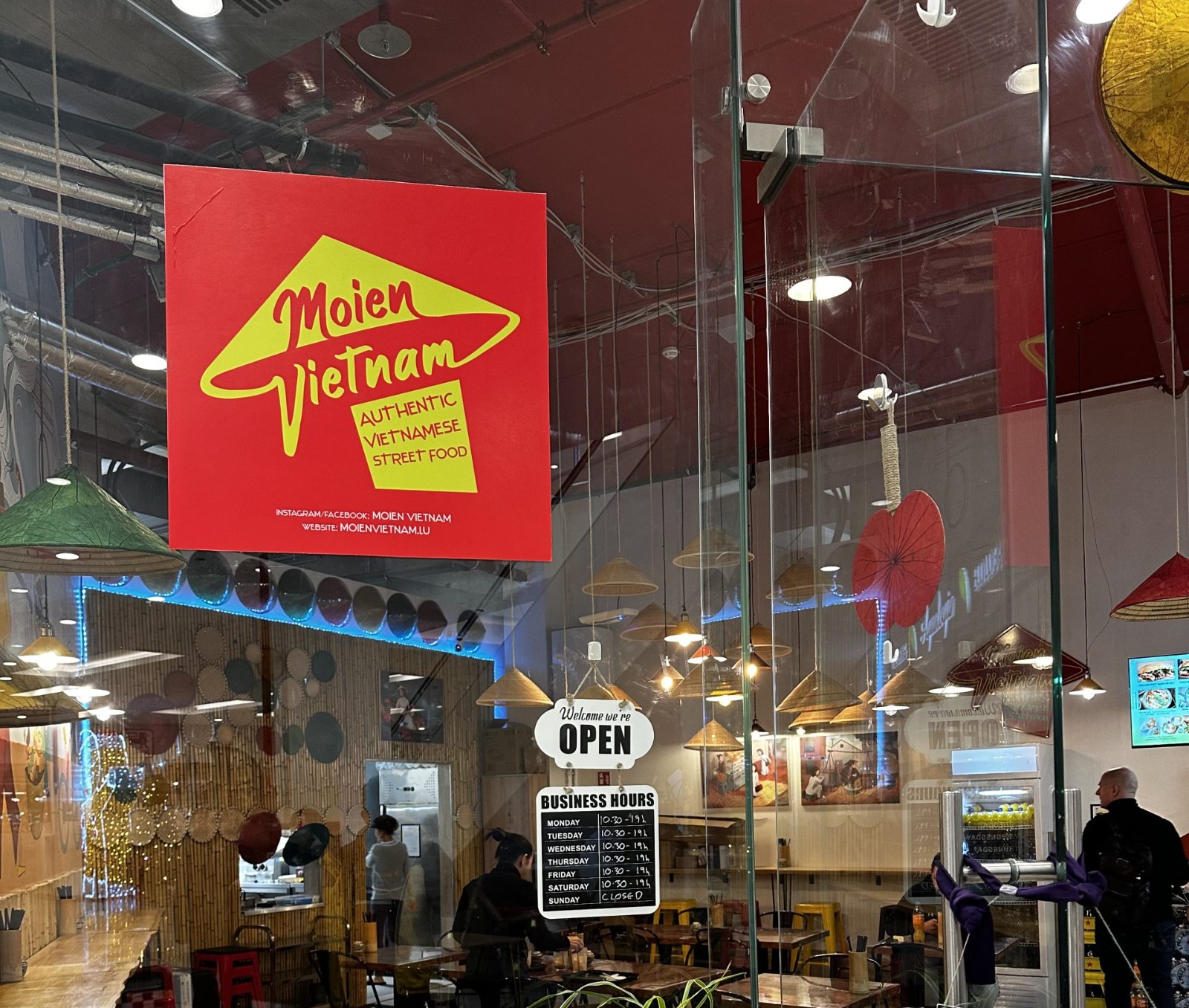 Inside Moien Vietnam in Belval Plaza, seen through the glass front