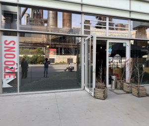 The Snooze frontage in Belval, with its vertical sign beside the entrance
